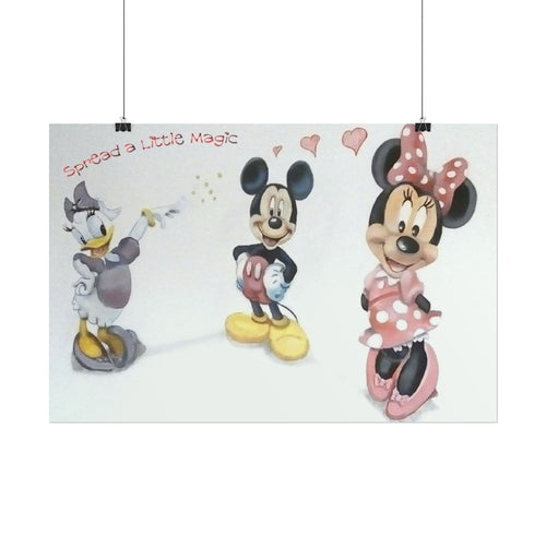 A rectangular wall art print featuring Disney characters Mickey Mouse, Minnie Mouse, and Daisy Duck on a white background, with the phrase 'Spread a little Magic' in red script. The print is shown hanging from two black clips against a light gray wall.