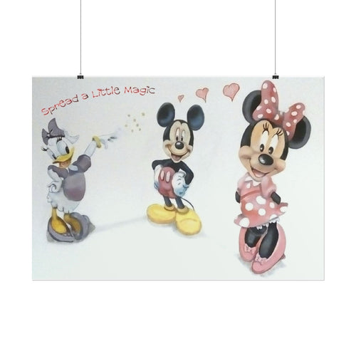 A rectangular wall art print featuring Disney characters Mickey Mouse, Minnie Mouse, and Daisy Duck on a white background, with the text 'Spread a little Magic' and small pink hearts. The print is shown hanging from two black wires against a white wall.
